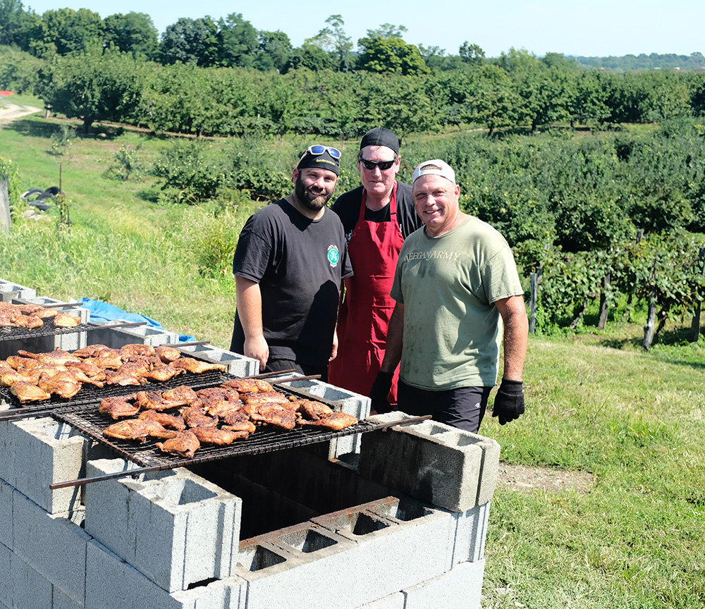 Manning the Chicken BBQ at the Tunnel to Towers fundraiser are [L-R] Matthew Keator, John Dolson and Bob Keator.